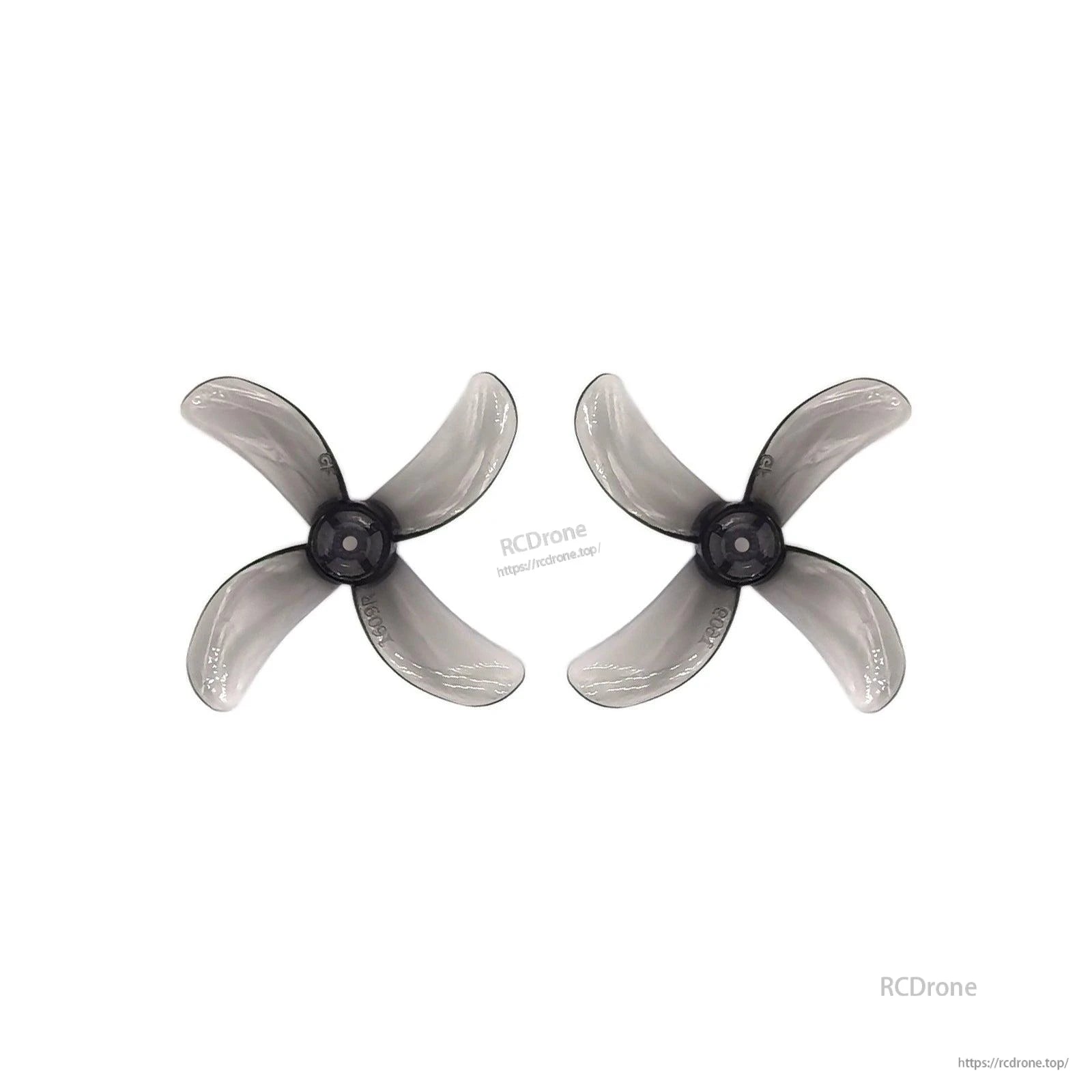 Translucent gray 4-blade propeller pair with dark hub, top view