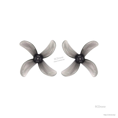 Translucent gray 4-blade propeller pair with dark hub, top view