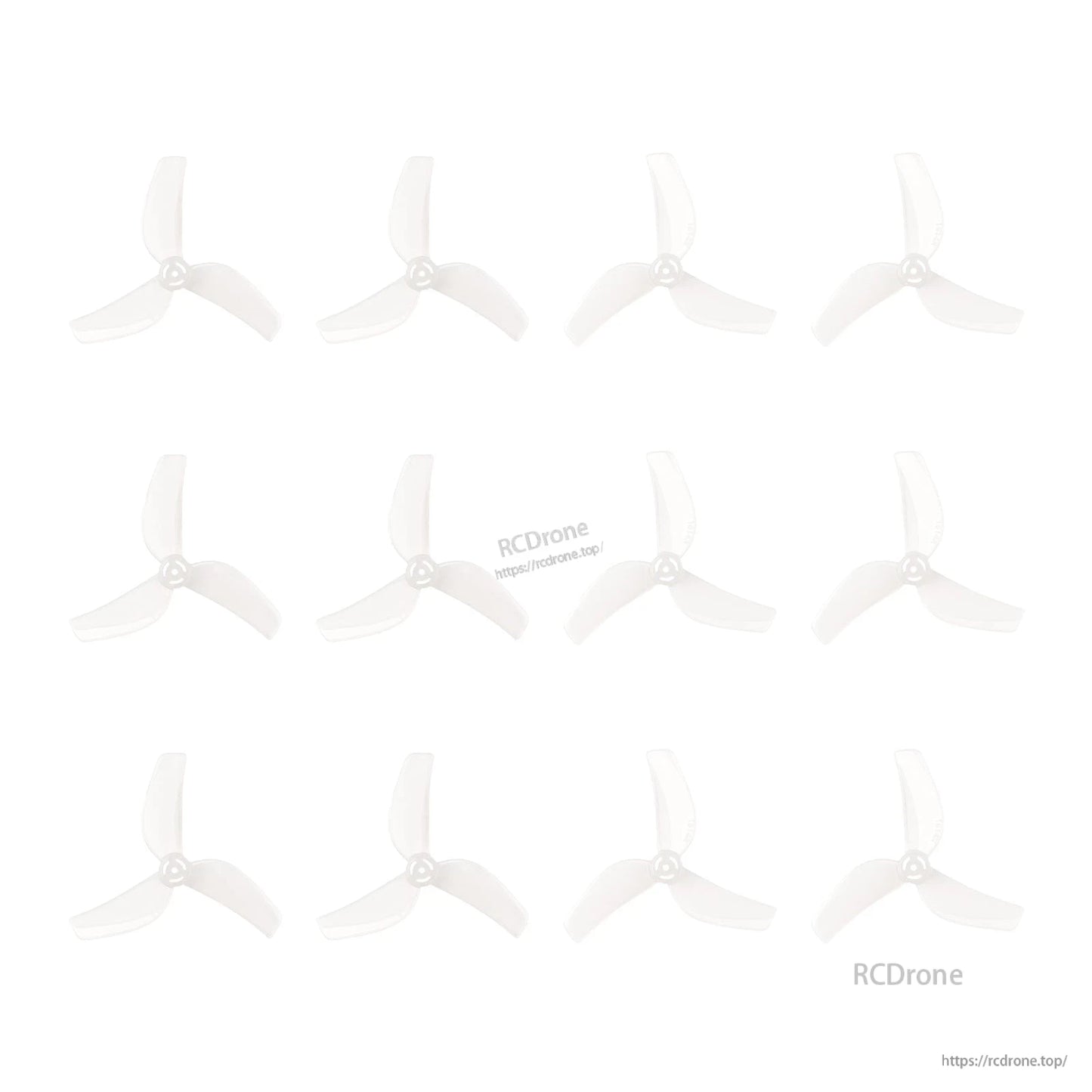 Multiple clear 3-blade propellers laid out in rows on white background, showing batch quantity
