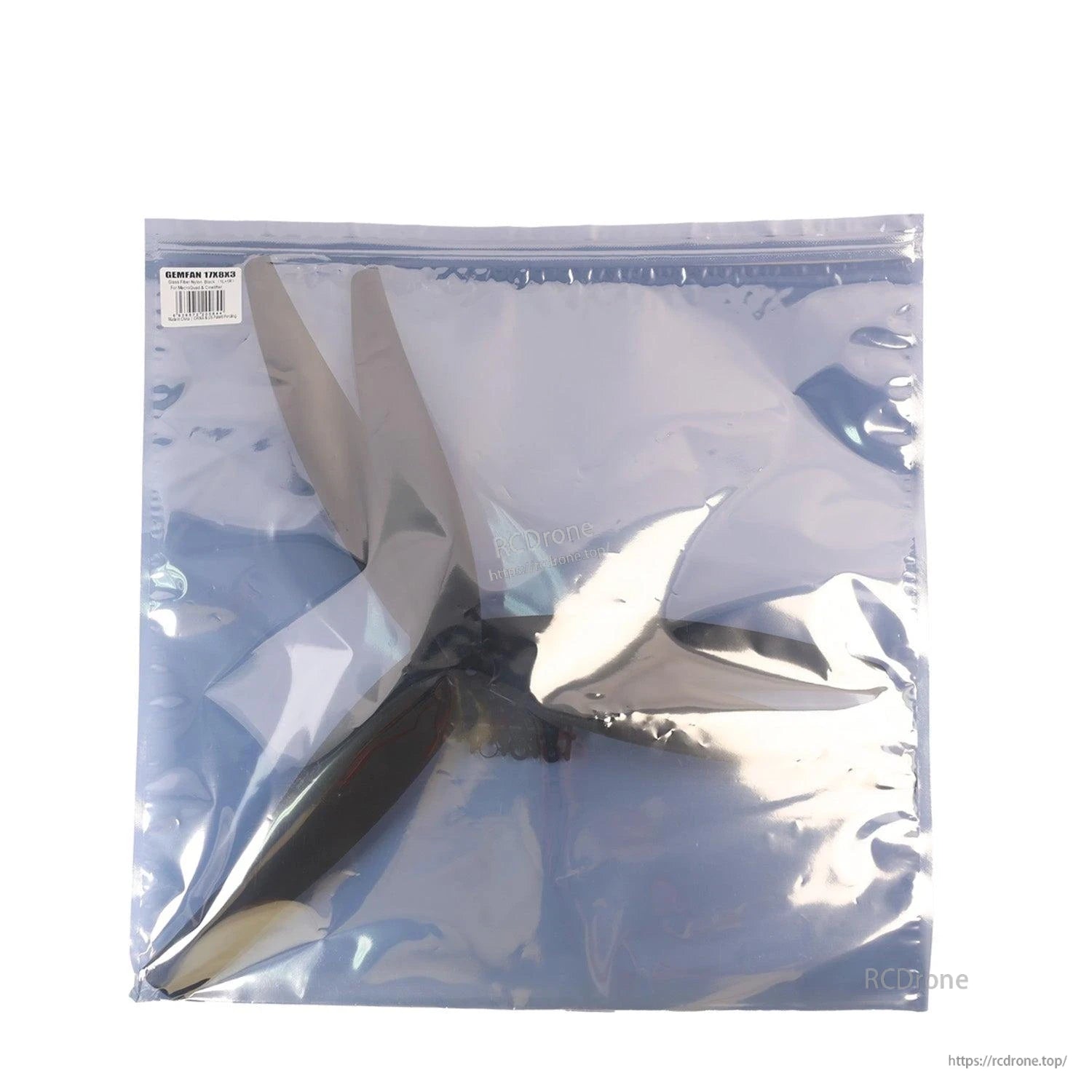 Anti-static bag package with propeller visible through reflective plastic, label at top left