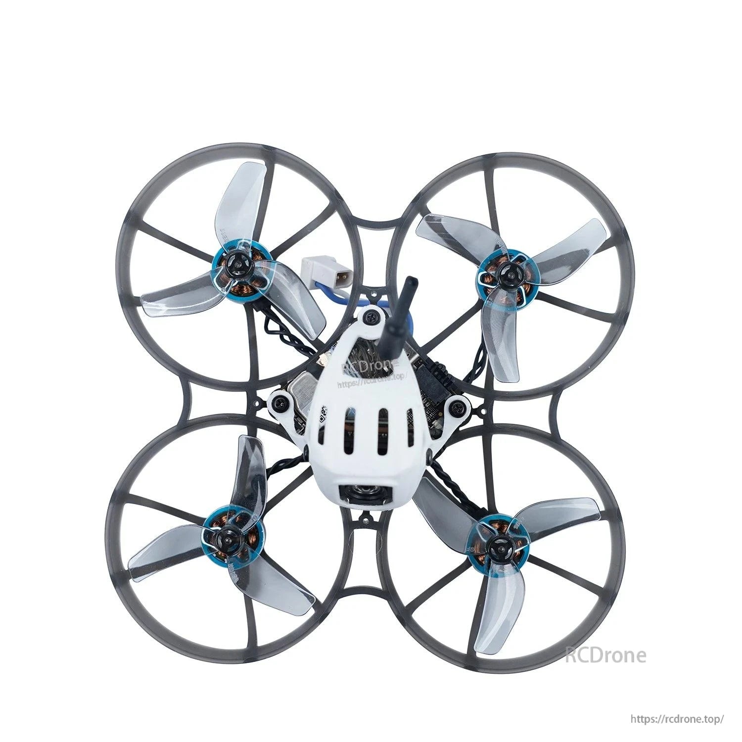 Ducted micro quad top view with clear gray tri-blade props installed in prop guards