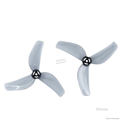 Two clear gray 3-blade micro drone propellers, clockwise and counterclockwise pair