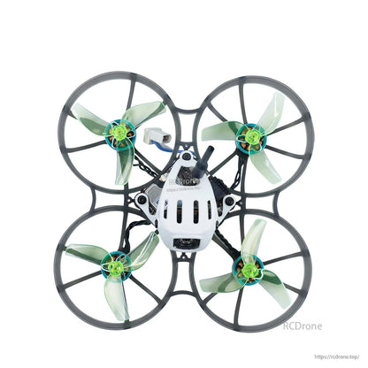 Ducted micro quad top view with neon green tri-blade props installed in prop guards