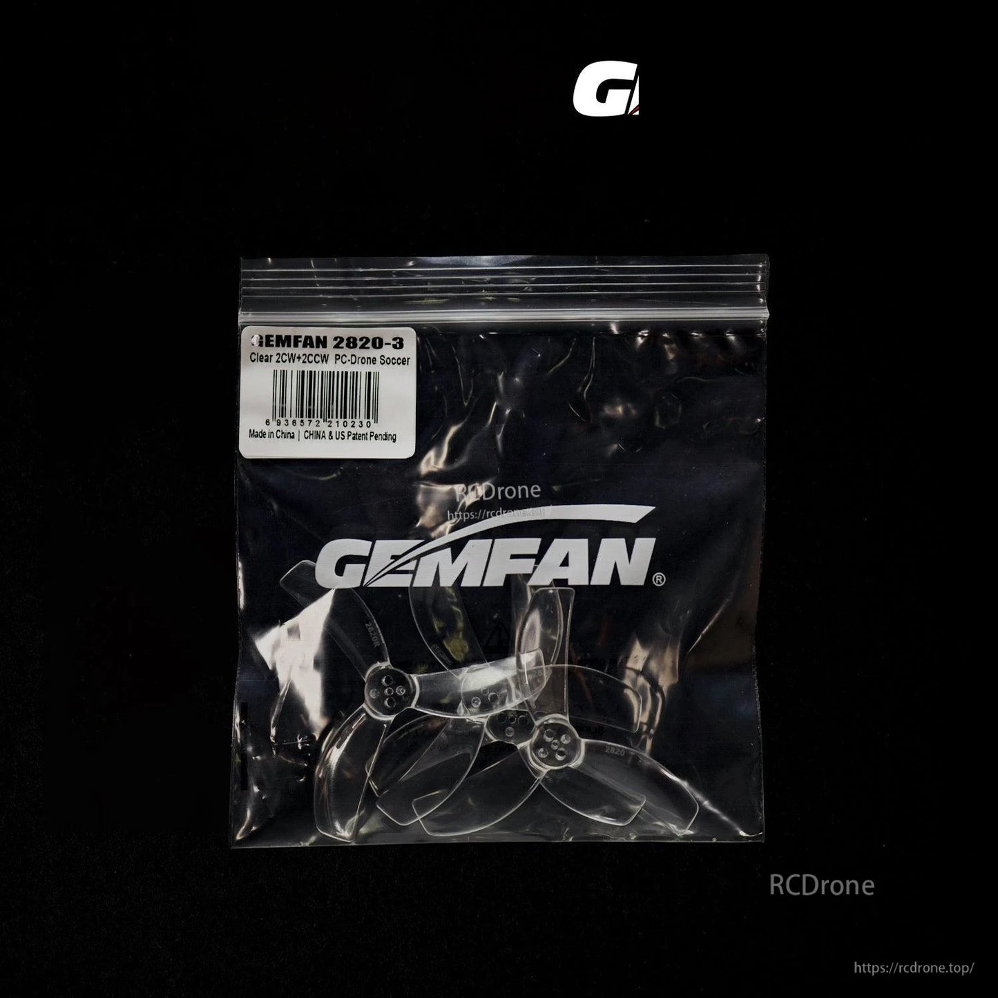Gemfan propellers in sealed bag, clear three-blade props shown through black-background packaging