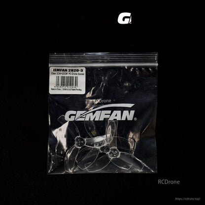 Gemfan propellers in sealed bag, clear three-blade props shown through black-background packaging