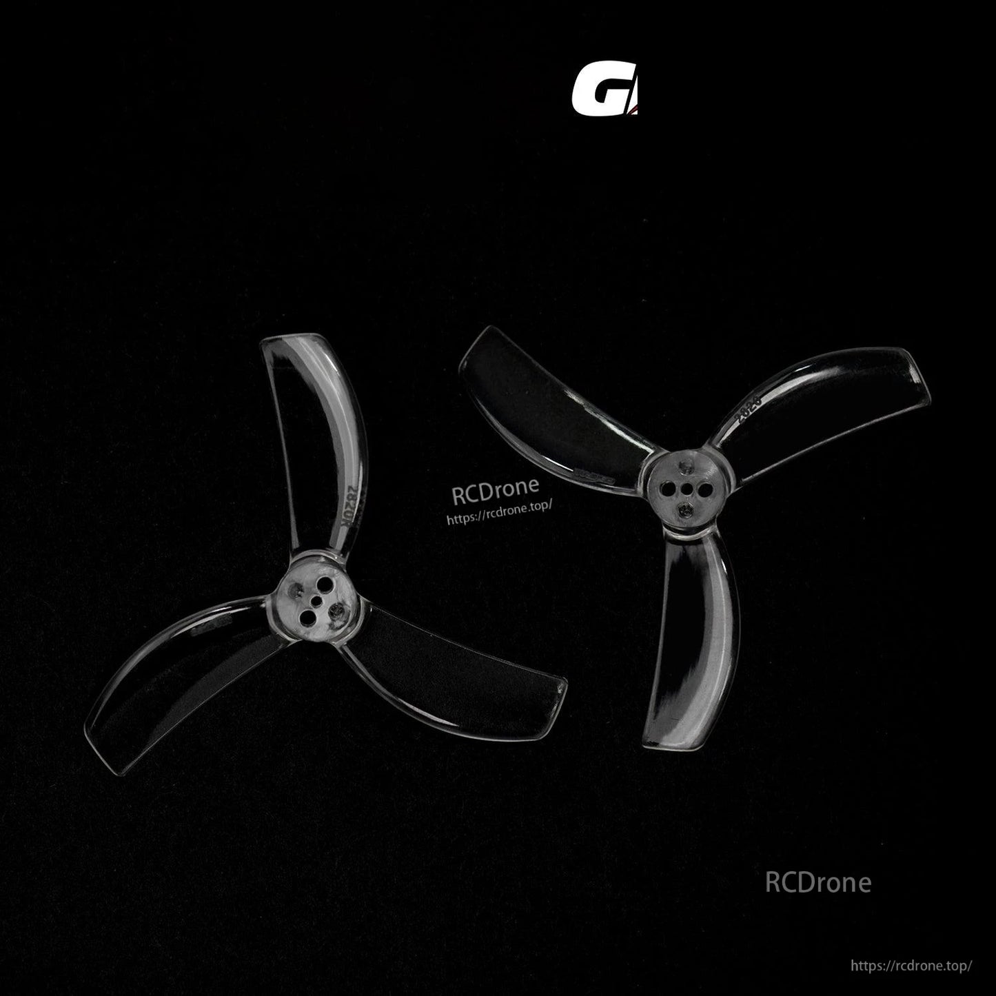 Pair of transparent three-blade propellers on black background, matching hub hole pattern