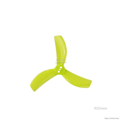 Single Gemfan 2820-3 three-blade propeller in neon yellow, hub mounting holes detail