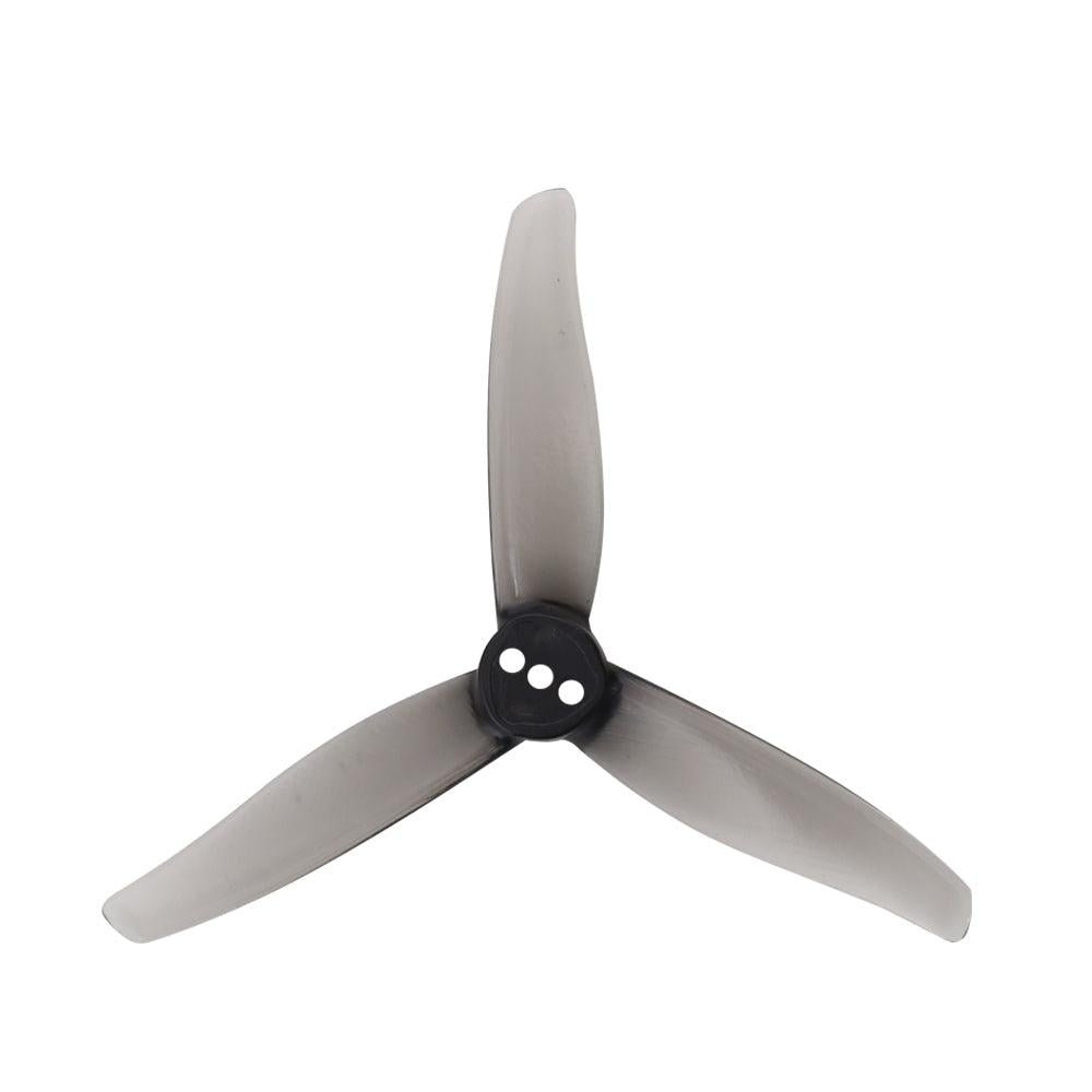 Smoke gray tri-blade drone propeller with black hub, 3 mounting holes, top view