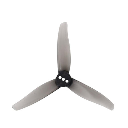 Smoke gray tri-blade drone propeller with black hub, 3 mounting holes, top view