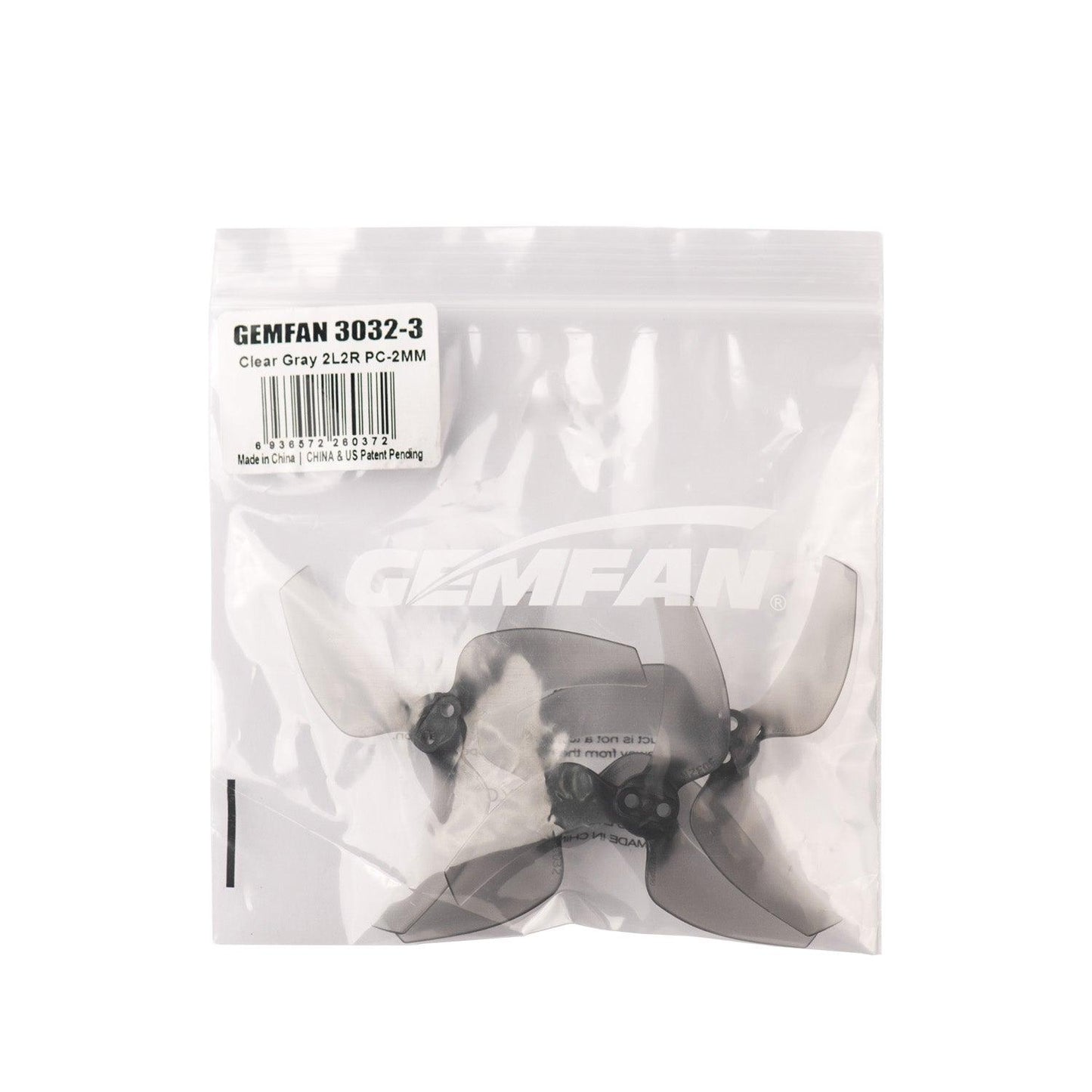 Retail packaging for Gemfan 3032-3 clear gray propellers, label reads 2L2R PC-2MM