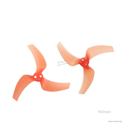 Two tangerine orange 3032-3 tri-blade props shown as a pair (clockwise and counterclockwise)