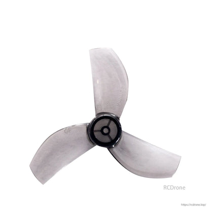 Translucent smoke gray 35mm 3-blade whoop propeller, top view of hub and blades
