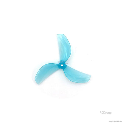 Blue translucent tri-blade propeller, centered top view on white