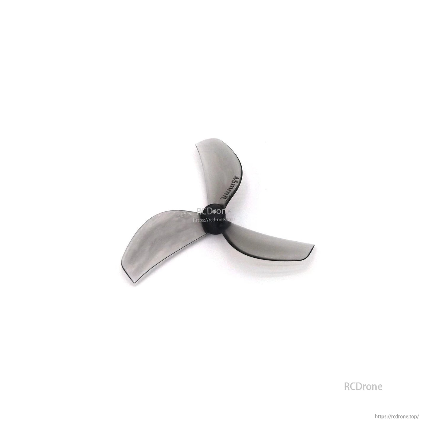 Smoky clear gray 3-blade propeller, angled view showing blade profile and pitch