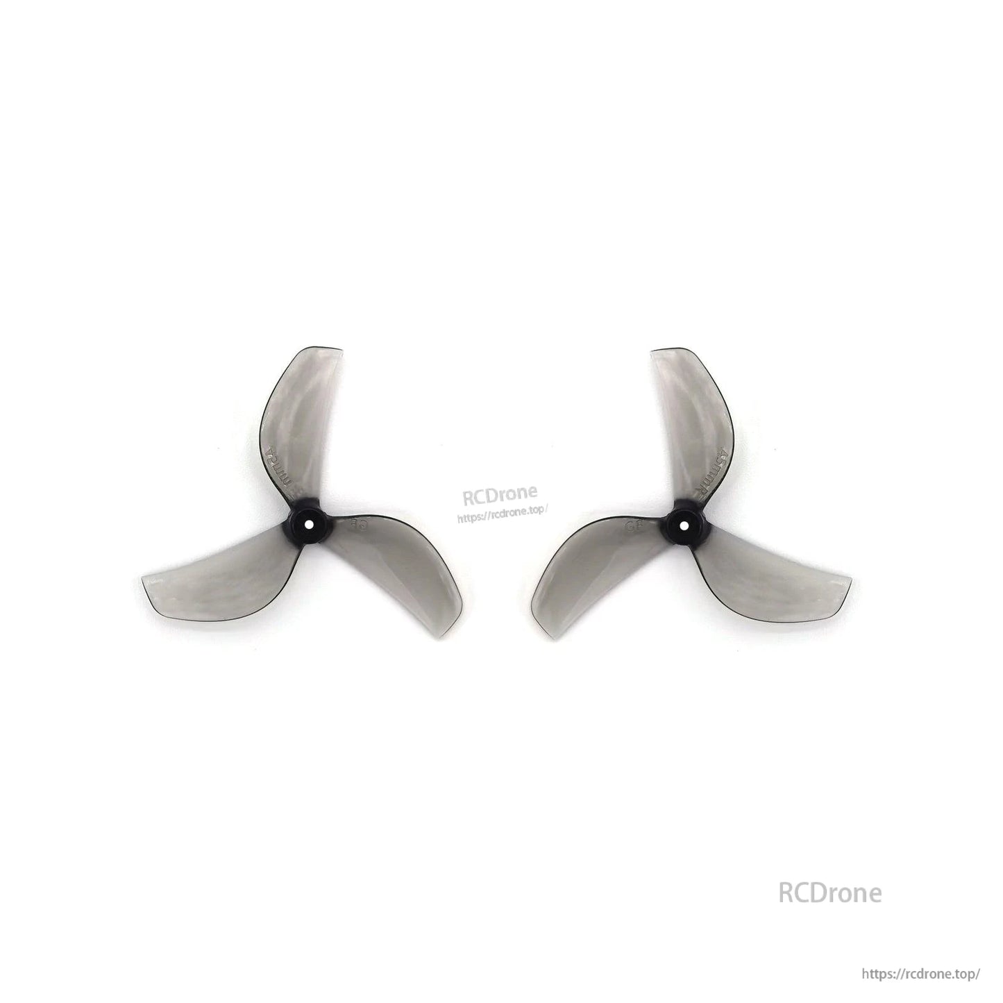 Two clear gray 3-blade propellers side by side, black hubs aligned