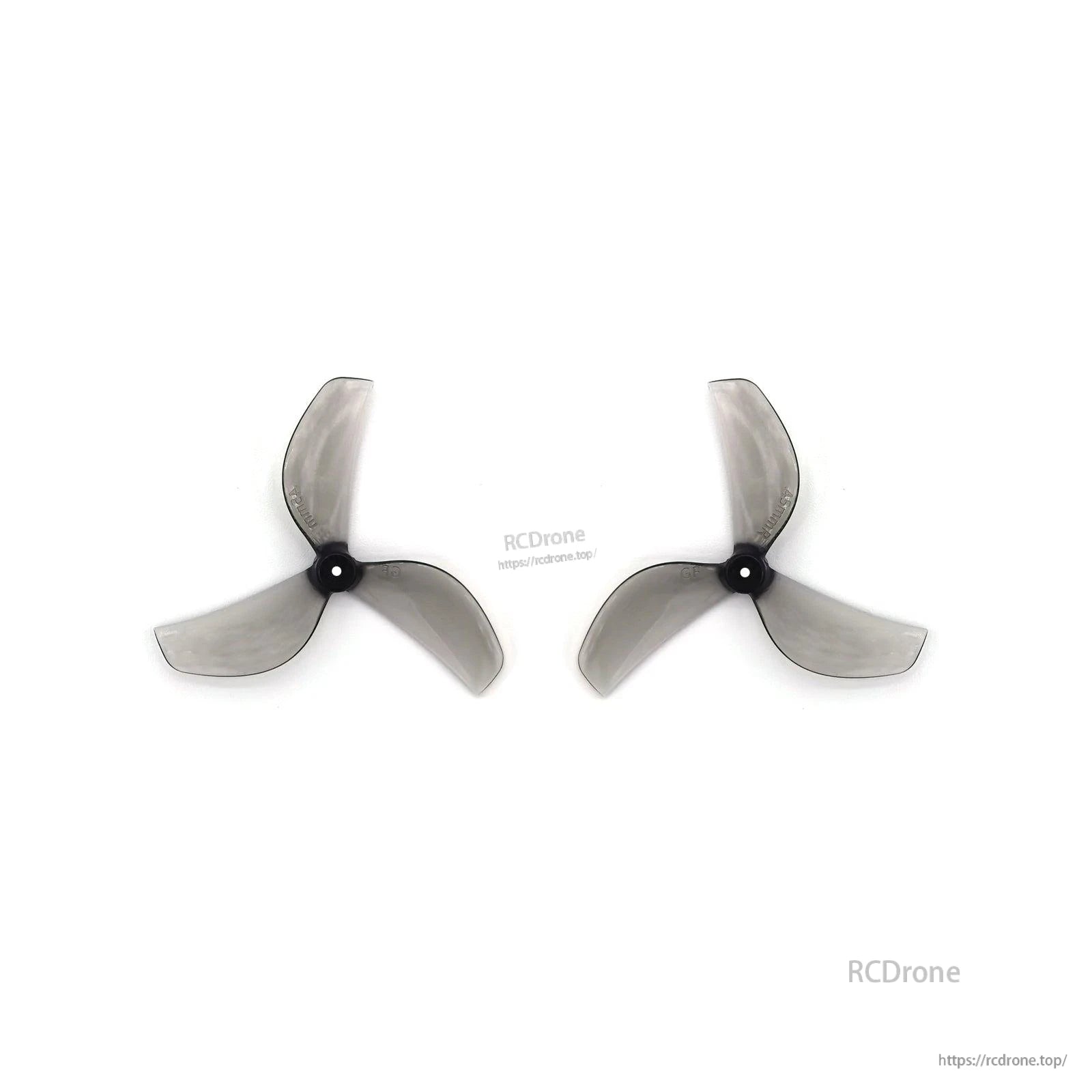 Two clear gray 3-blade propellers side by side, black hubs aligned