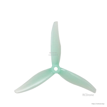 Mint green translucent 3-blade propeller close-up showing hub and blade shape