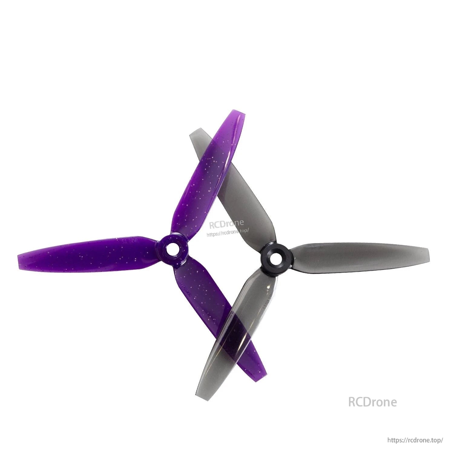 Gemfan 513D-3 3-blade propellers shown crossed, purple and gray blades, CW and CCW pair view