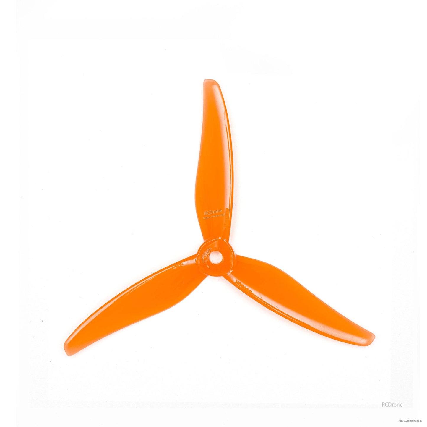 Translucent orange 3-blade propeller close-up on white background, hub and blade shape