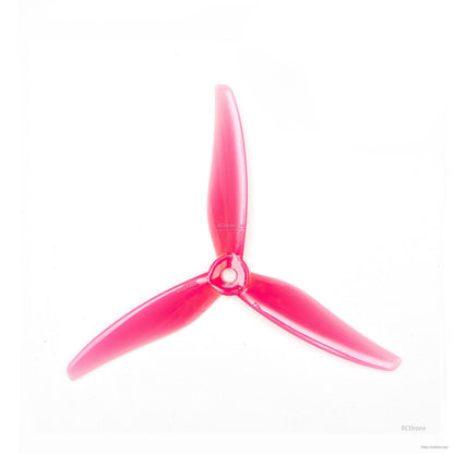 Translucent pink 3-blade propeller close-up on white background, showing hub and blades
