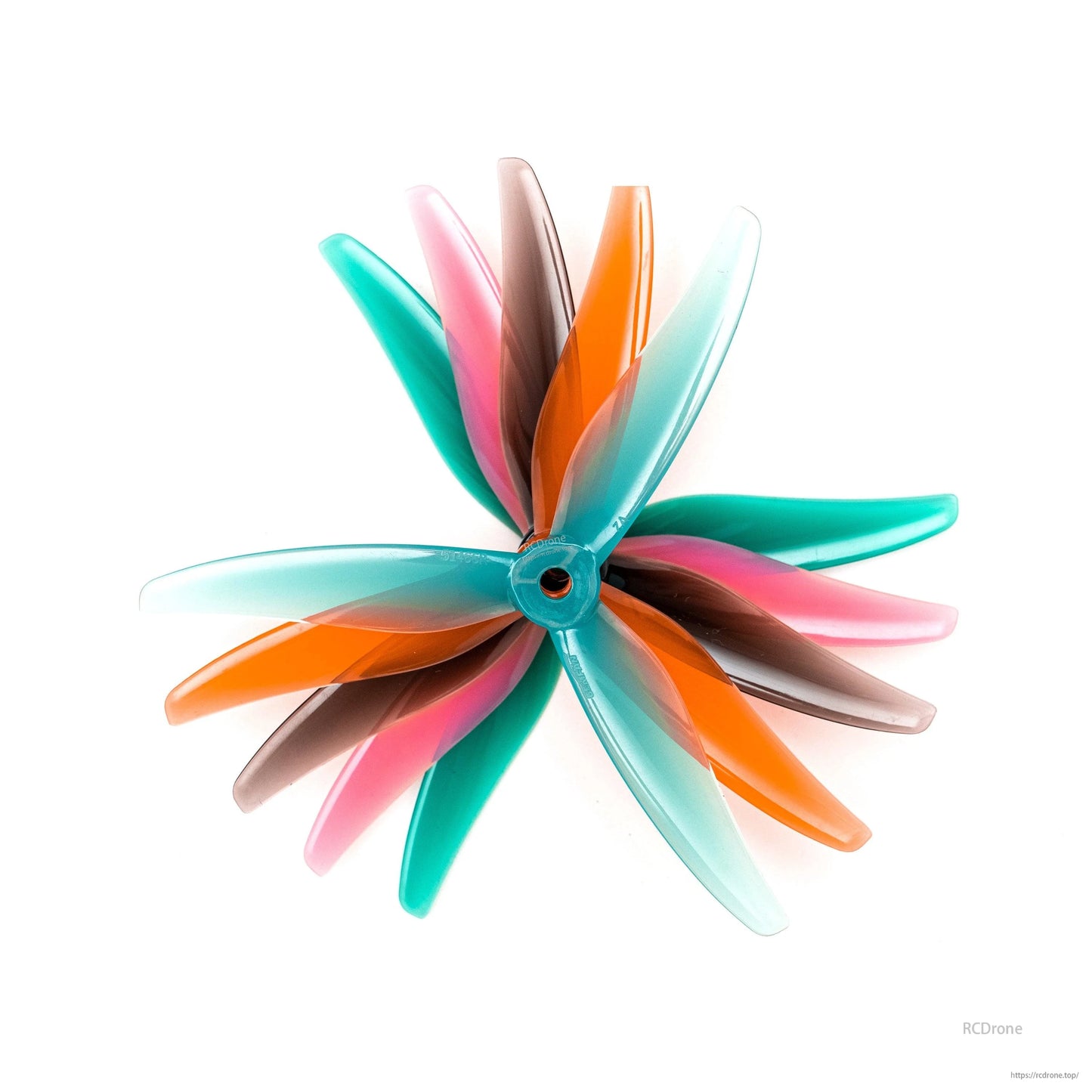 Assorted tri-blade propellers stacked together, mixed translucent colors showing blade profile