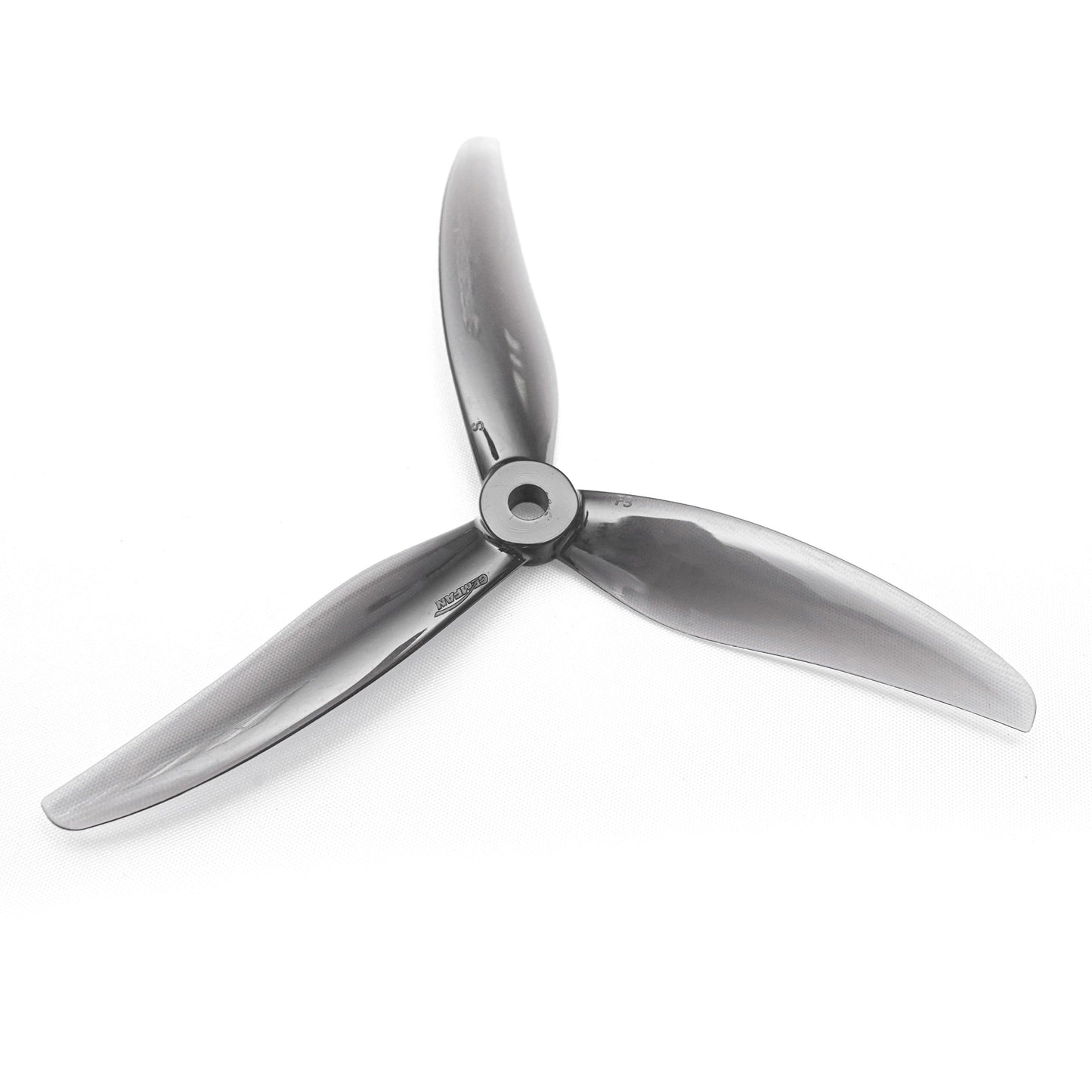 Dark gray 3-blade Gemfan 5.1x3x3 freestyle propeller, top view showing hub and blade profile