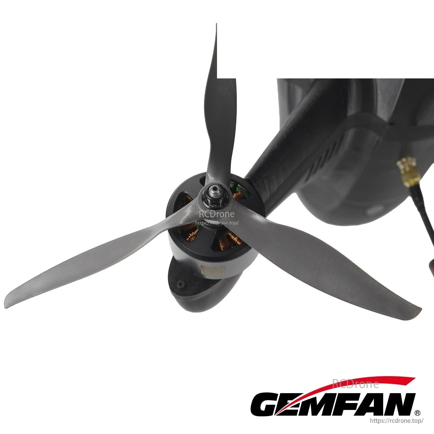 Gemfan 3-blade propeller mounted on a drone motor, installed view showing fit on the hub