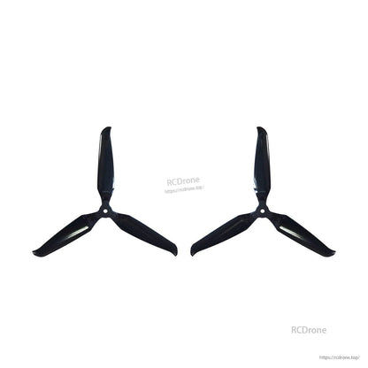Two assembled 3-blade propellers spaced apart on white background, black finish