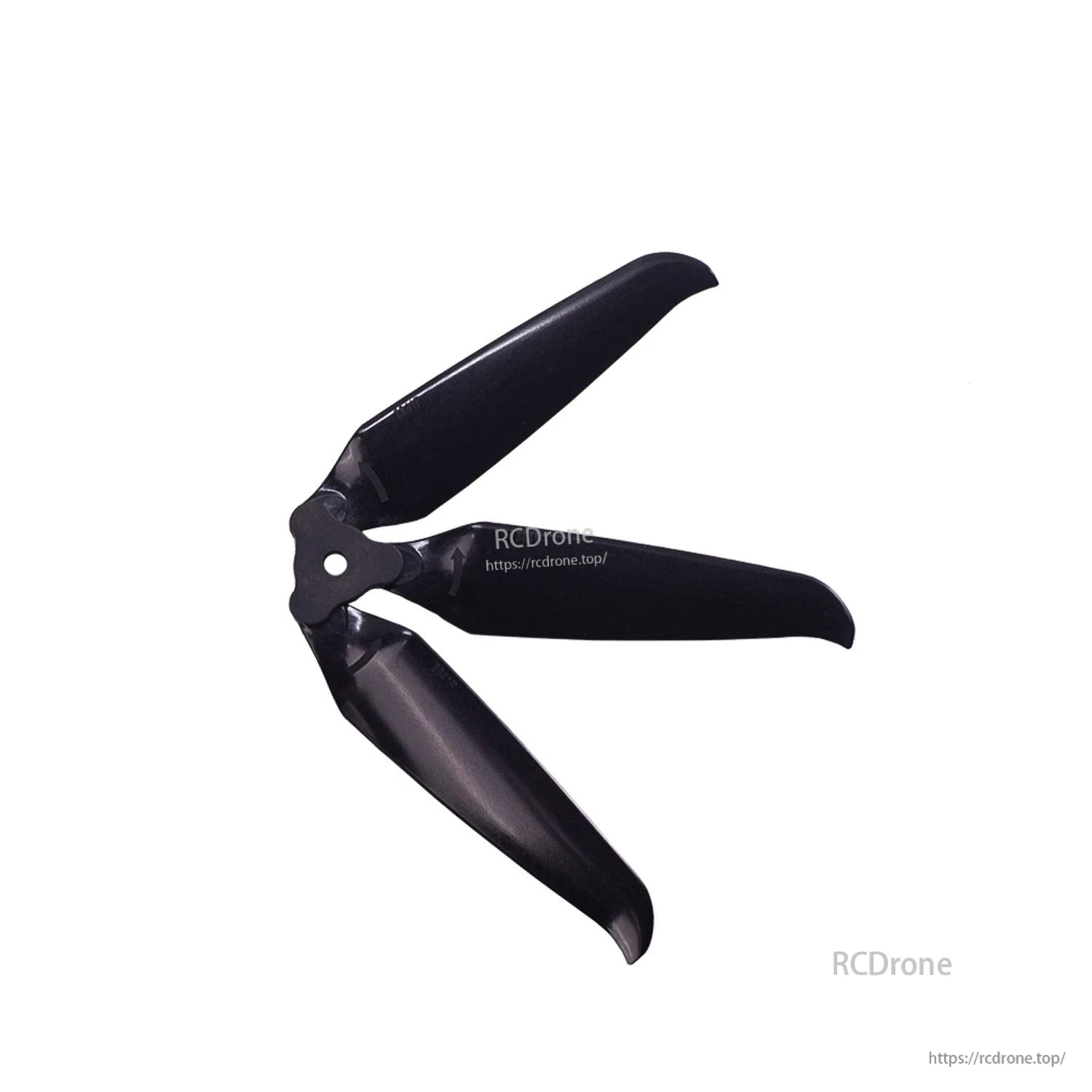 Close-up of assembled 3-blade prop showing blade shape and center mounting hole