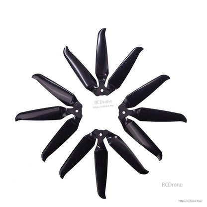 Multiple assembled 3-blade propellers arranged in a circle pattern on white background