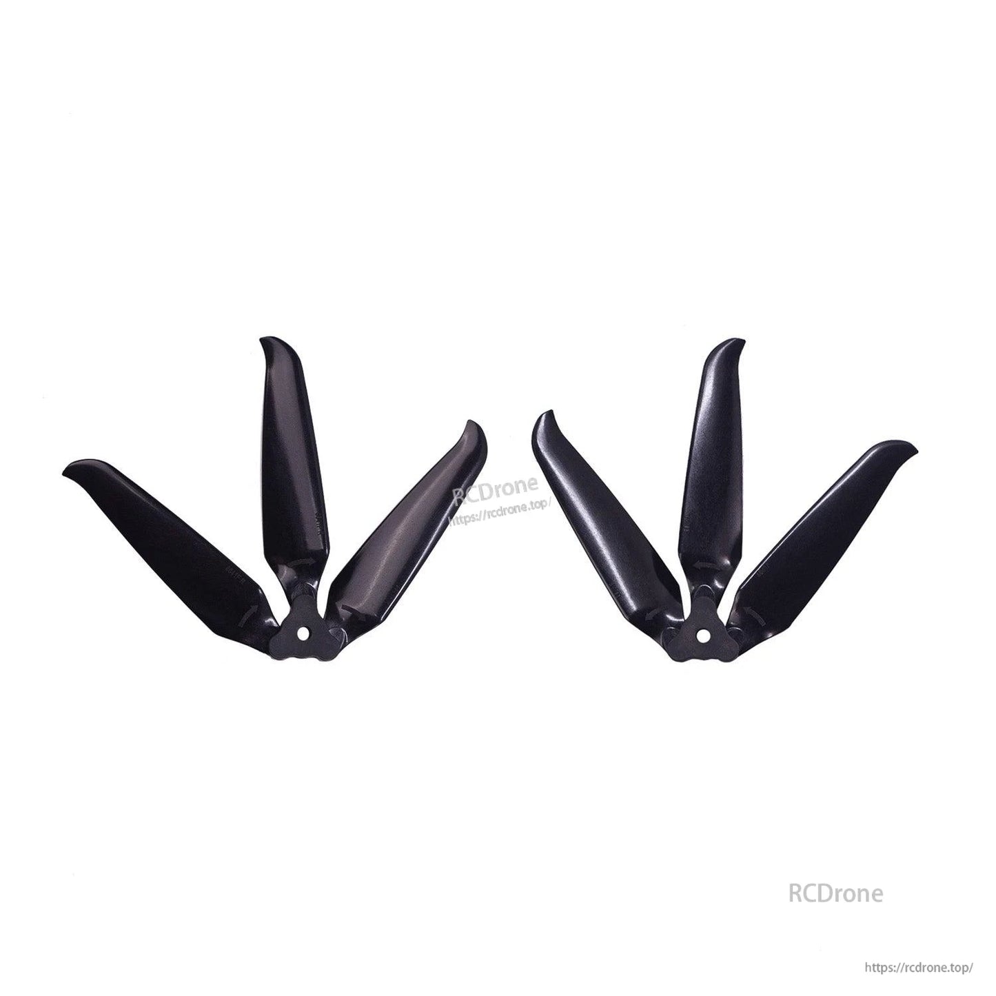 Two assembled 3-blade props shown side by side, hub center holes visible