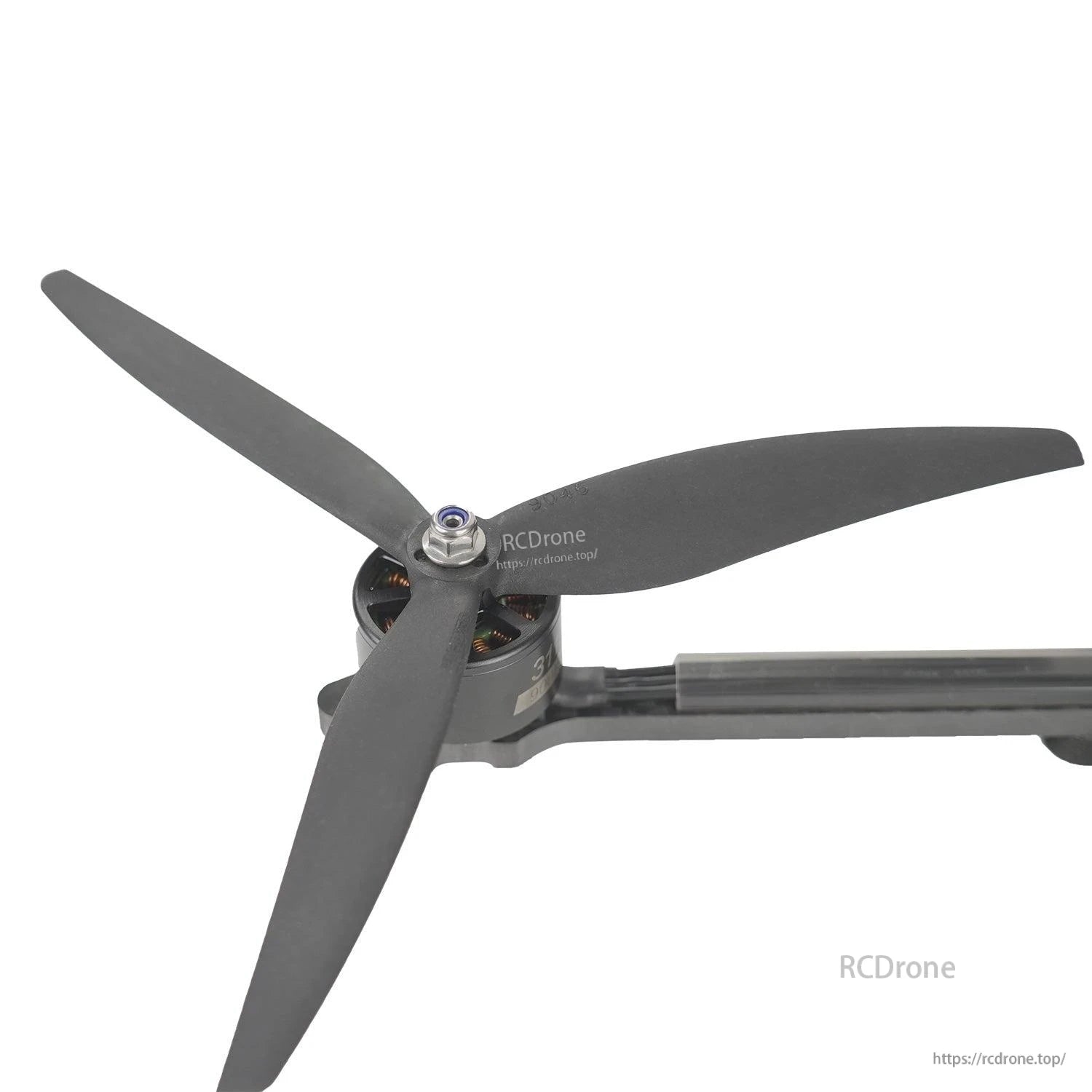 Gemfan 9046-3 tri-blade prop mounted on drone motor arm, close-up installed example