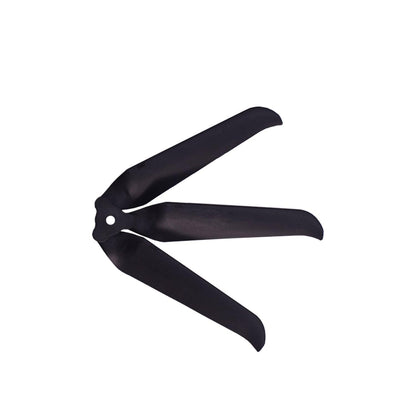 Black 3-blade propeller angled view showing blade curve and center mounting hole