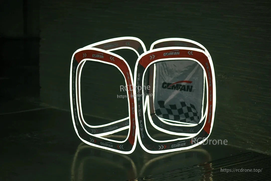 FPV racing gate cube shown in dark setting with reflective edge outlines for visibility