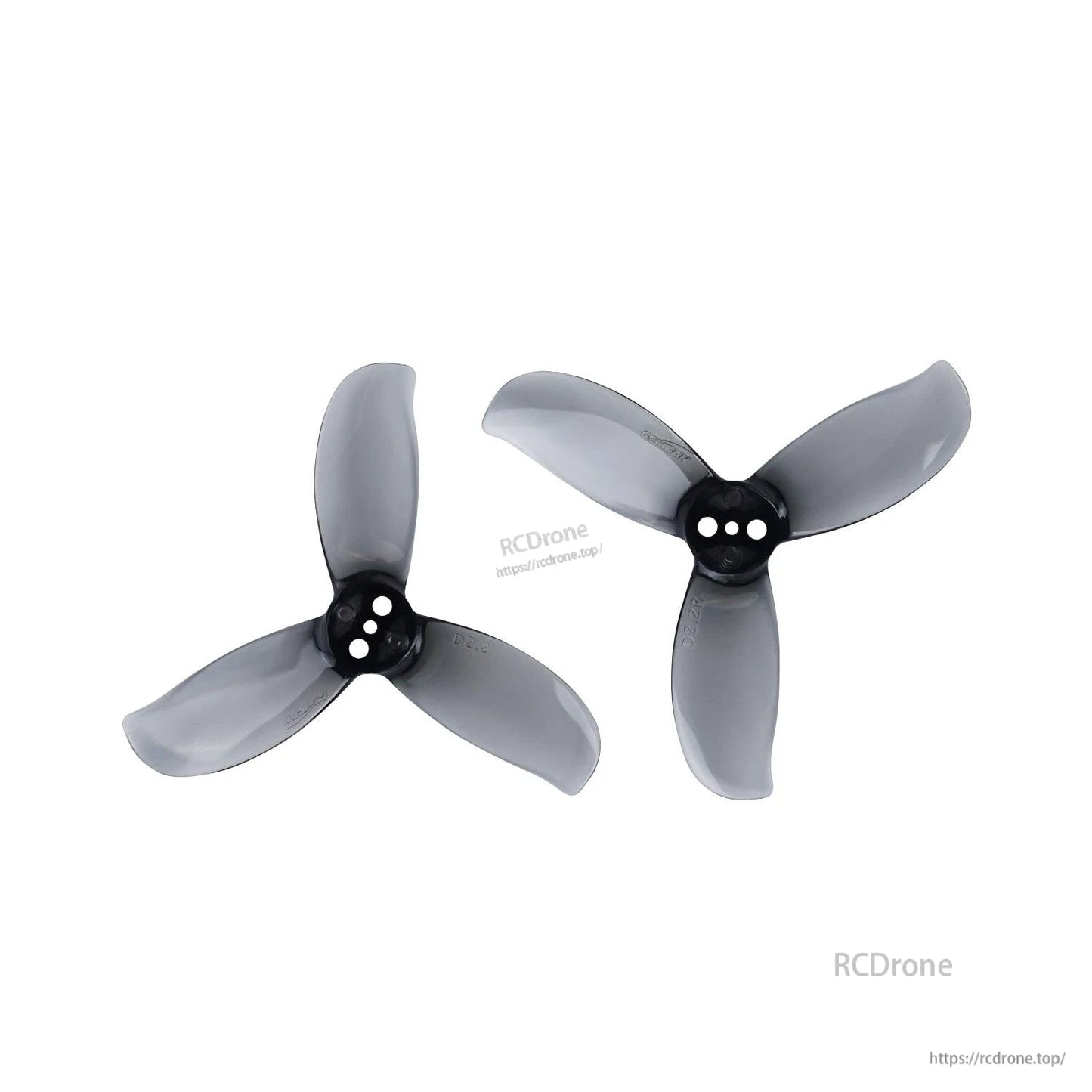 Two smoke gray 3-blade propellers with three-hole hubs, left and right orientations