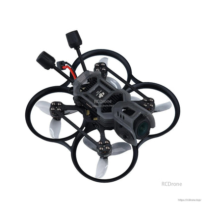 Ducted cinewhoop-style quadcopter fitted with gray 3-blade props inside prop guards