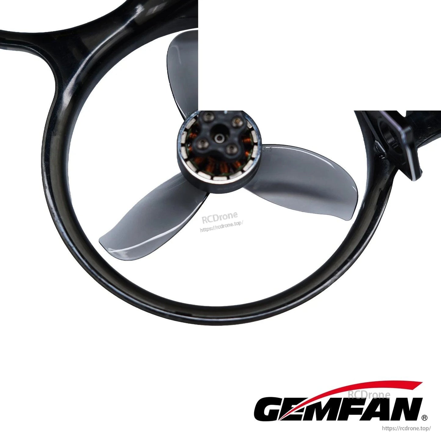 Close-up of dark gray tri-blade propeller mounted in a ducted ring around the motor