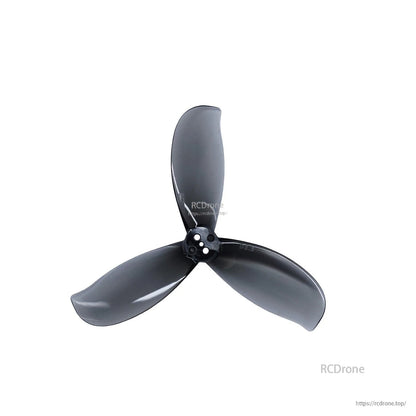 Dark gray 3-blade propeller close-up showing curved blade profile and hub mounting holes