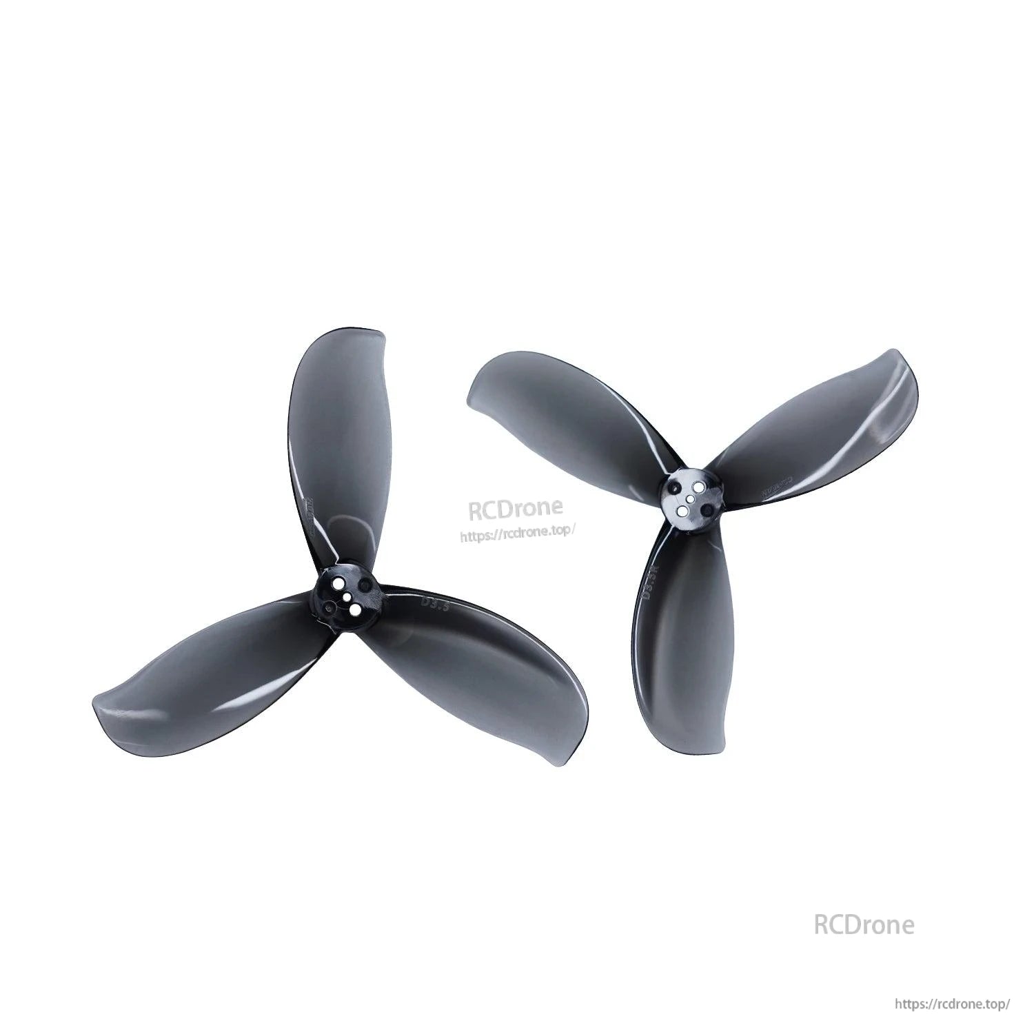 Two dark gray tri-blade propellers shown as a pair, different orientations on white background