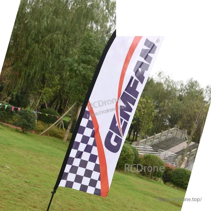 Outdoor feather flag banner with GEMFAN logo and checkered pattern displayed on grass field