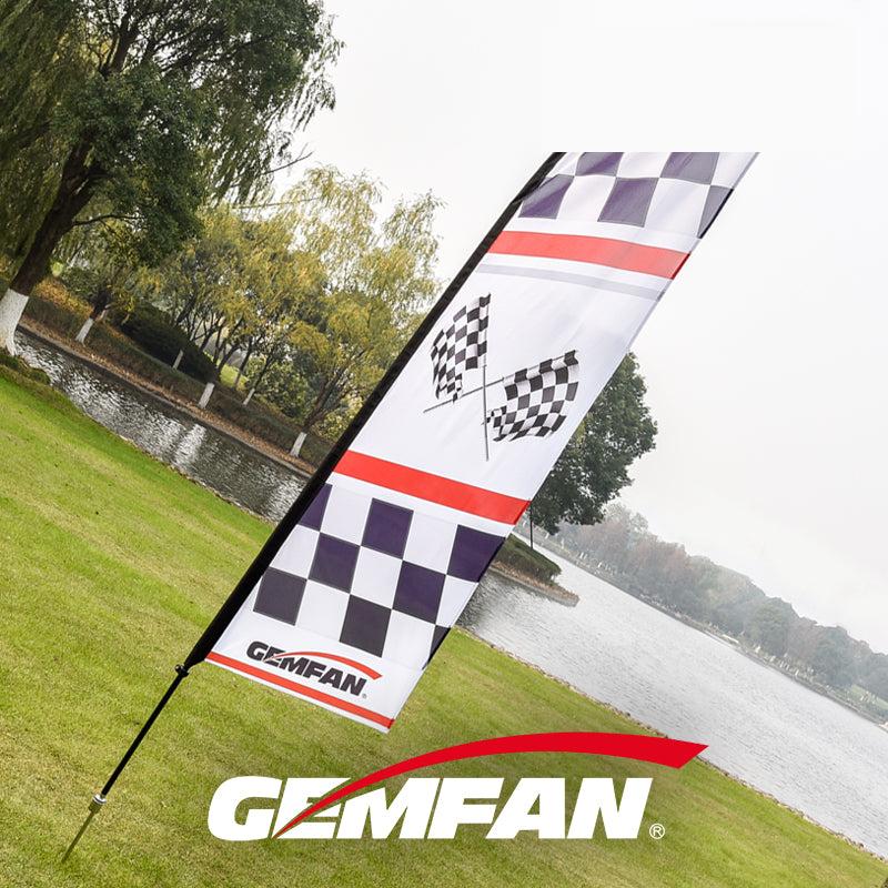 Gemfan Flag-S3.6M flag kit displayed outdoors, tall feather flag with checkered pattern near a lake