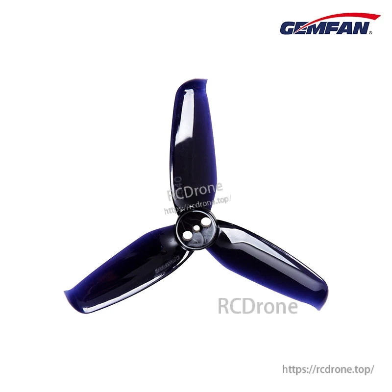 Dark blue and black 3-blade propeller, 3-hole mounting hub, angled top view on white