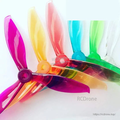 Assorted Gemfan Flash 5149-3 PC propellers in multiple colors shown together, overlapping set