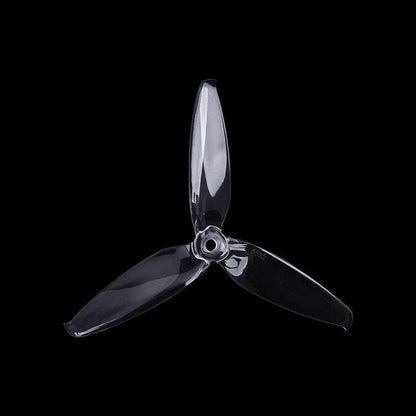 Smoke gray transparent 3-blade propeller on black background, top view showing blade profile