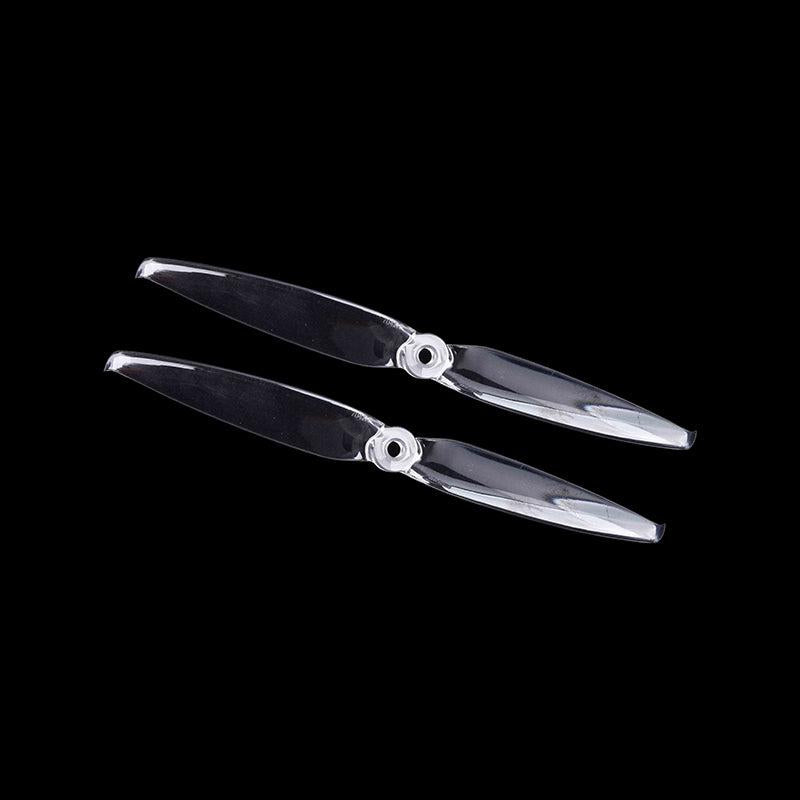 Clear two-blade propeller pair with hub detail, translucent finish on black background