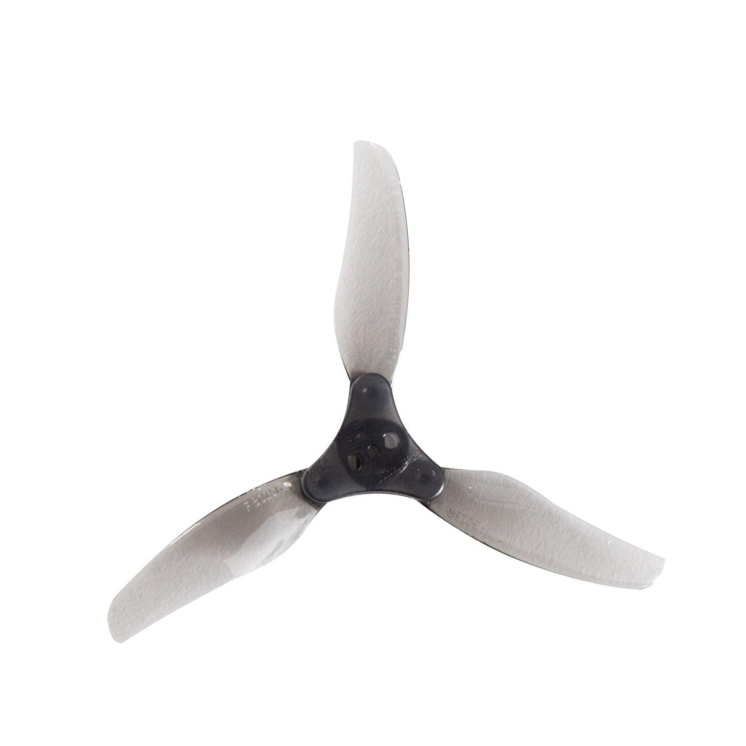 Assembled 3015-3 tri-blade folding prop with black center hub and translucent gray blades