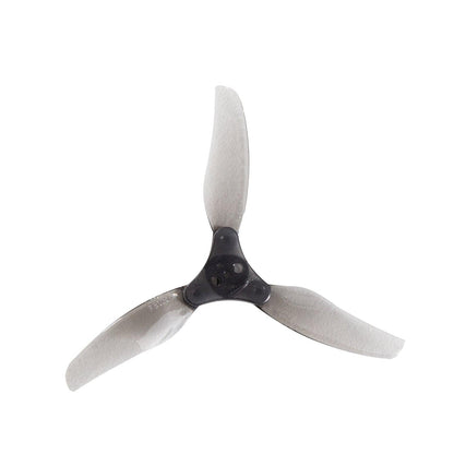 Assembled 3015-3 tri-blade folding prop with black center hub and translucent gray blades