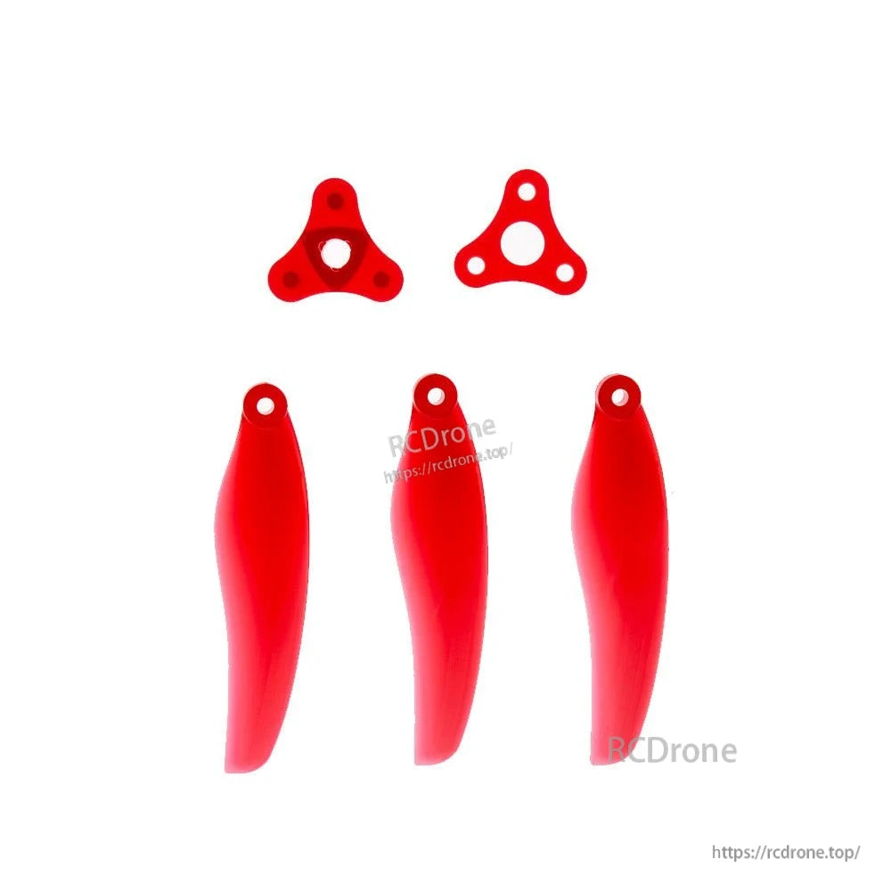 Folding propeller parts layout: three red blades and two matching hub plates with mounting holes