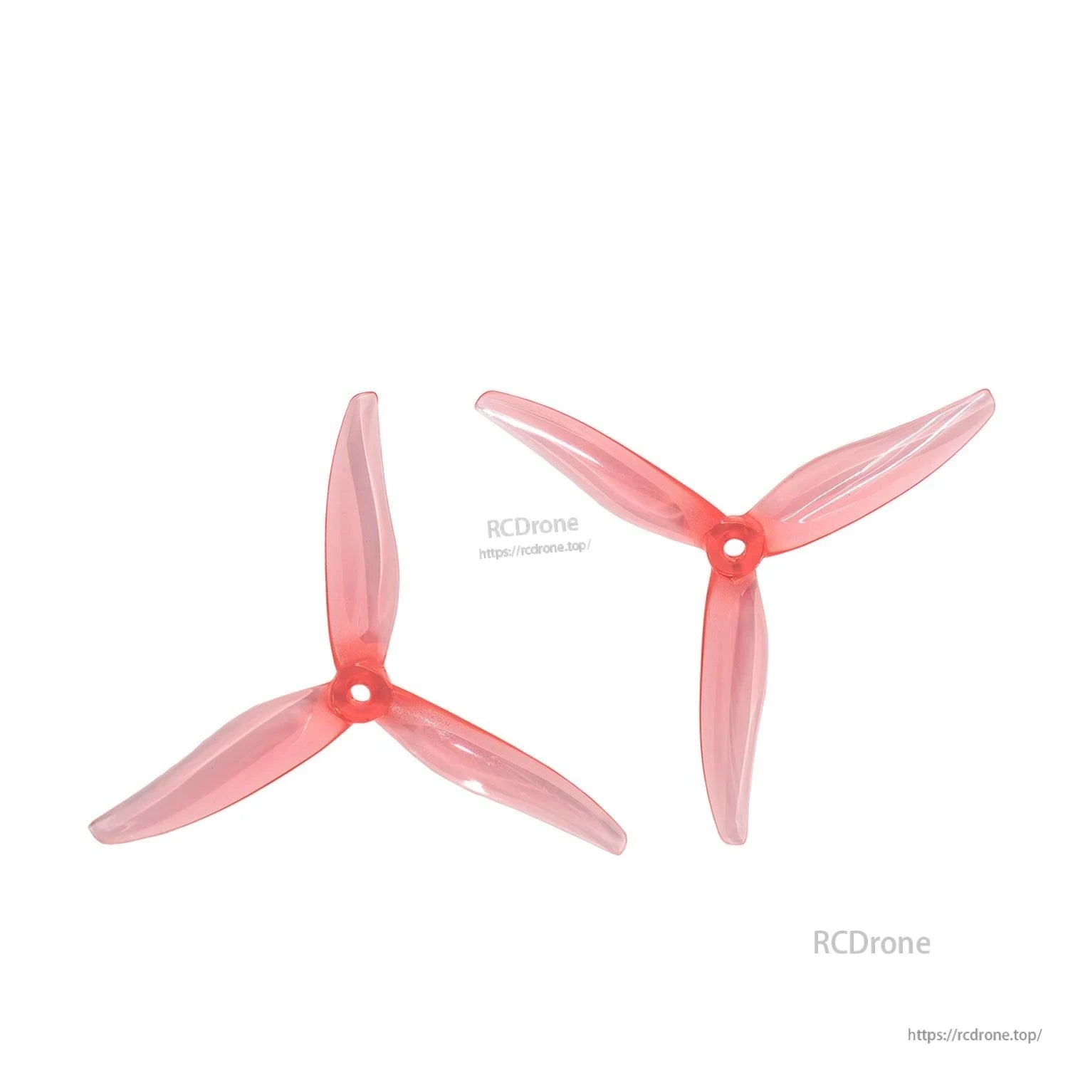 Pair of translucent red tri-blade propellers displayed on white background