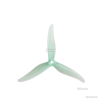 Translucent mint green 3-blade 5-inch propeller with center mounting hole, top view